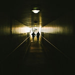 Photo of two persons at the end of a tunnel