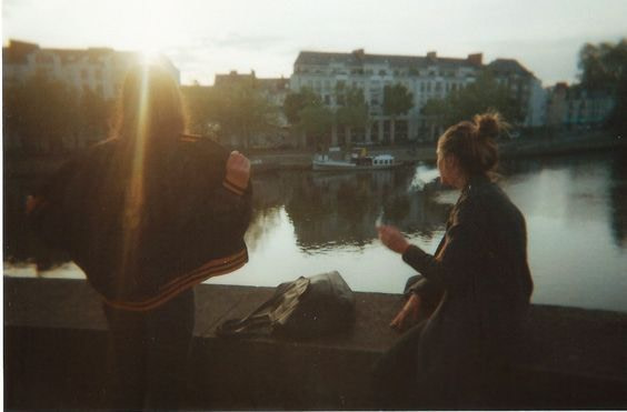 Two Girls on a bridge.