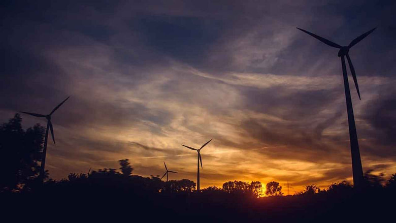 Image of windmills during sunset